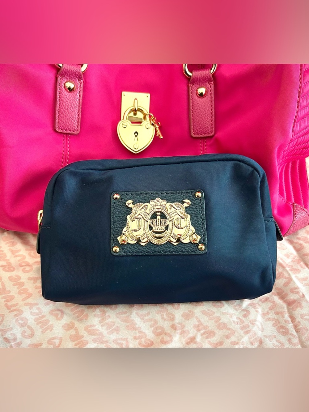 Juicy Couture Navy Blue Cosmetic bag with large intricate gold emblem on front